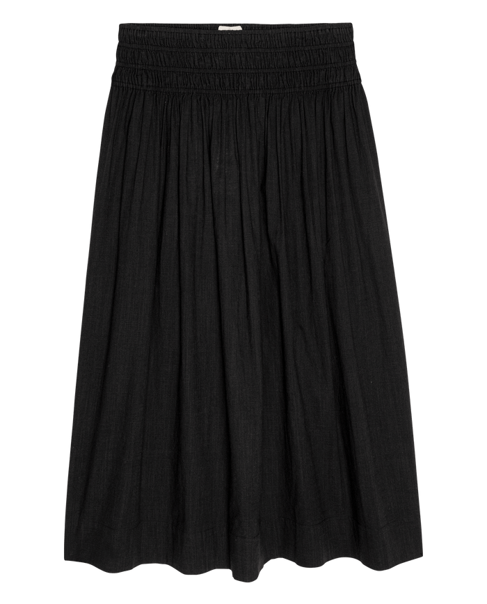 The Viola Skirt by THE GREAT. SU26 in black is a knee-length women's skirt with a gathered, elastic waistband and flowy silhouette—versatile for any occasion.
