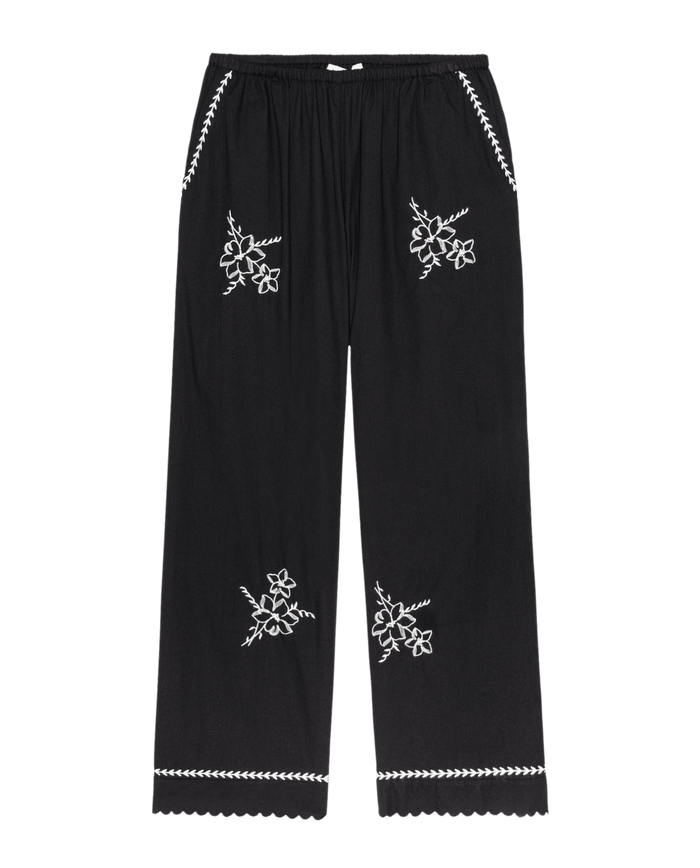 THE GREAT.'s The Weekend Pant W/ Hanky Embroidery in black features white hanky embroidery on the front, scalloped hems, and decorative stitching at the pockets and waistband.