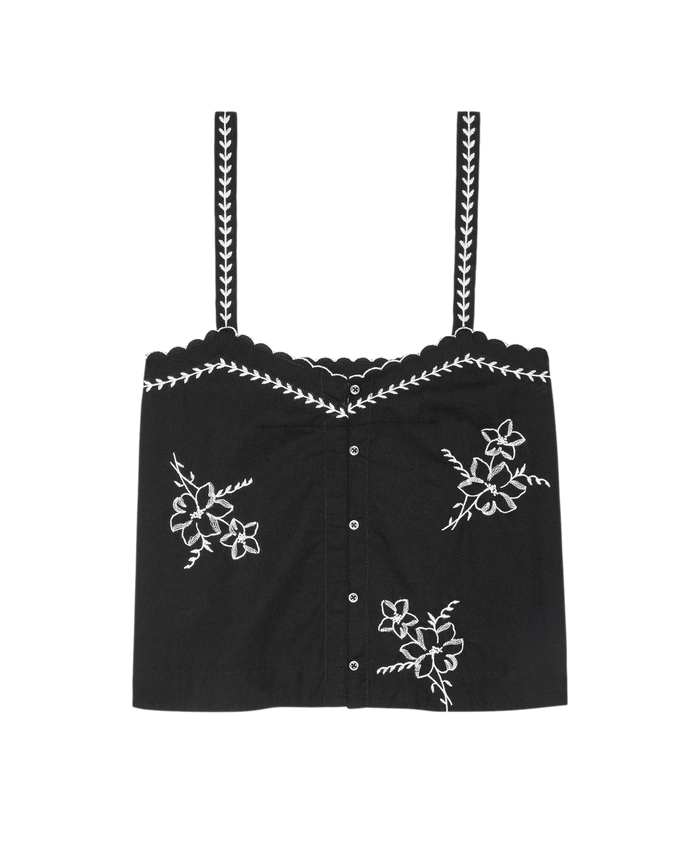 The Weekend Tank W/ Hanky Embroidery by THE GREAT. in black features a scalloped neckline, button front, and white hanky embroidery on the front and straps.