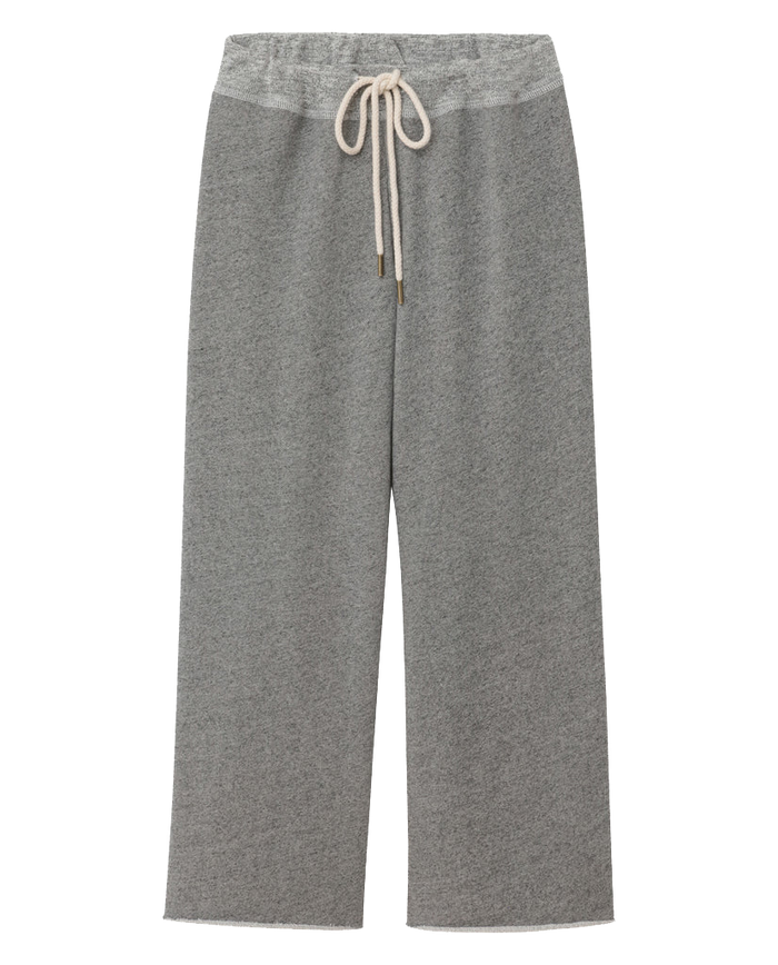 The Wide Leg Cropped Sweatpant in Varsity Grey by THE GREAT. CORE KNITS features a wide-leg design, a white drawstring waist, and is crafted from a soft, fleecy material.