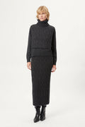 woman wearing a dark gray Woolen Cable Bib dark