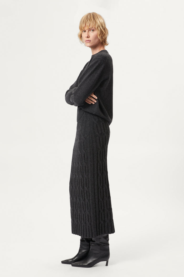 woman wearing a dark grey Woolen Cable knit skirt