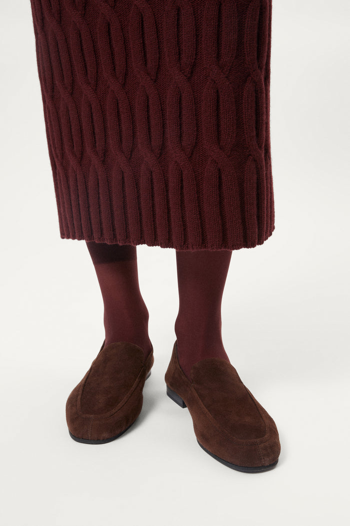 woman wearing a burgundy Woolen Cable knit skirt