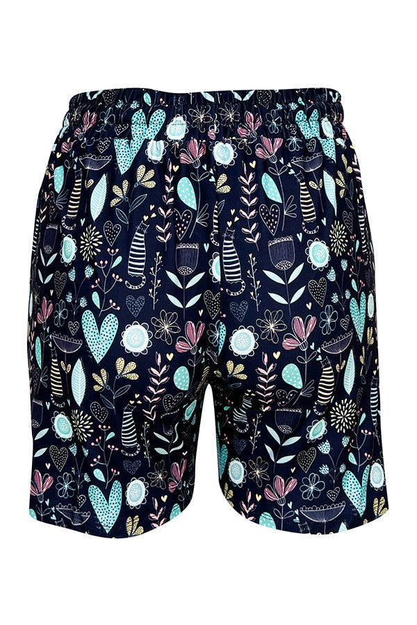 Wildflower Whiskers Jogger Shorts with pastel floral, hearts, and striped kitties on blue background, slim fit with elastic waistband and side pockets