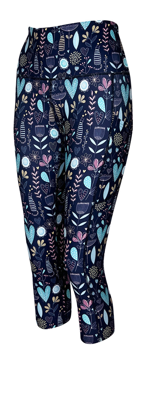 Dark blue leggings with pockets featuring pastel-striped kitties, floral patterns, and heart motifs.