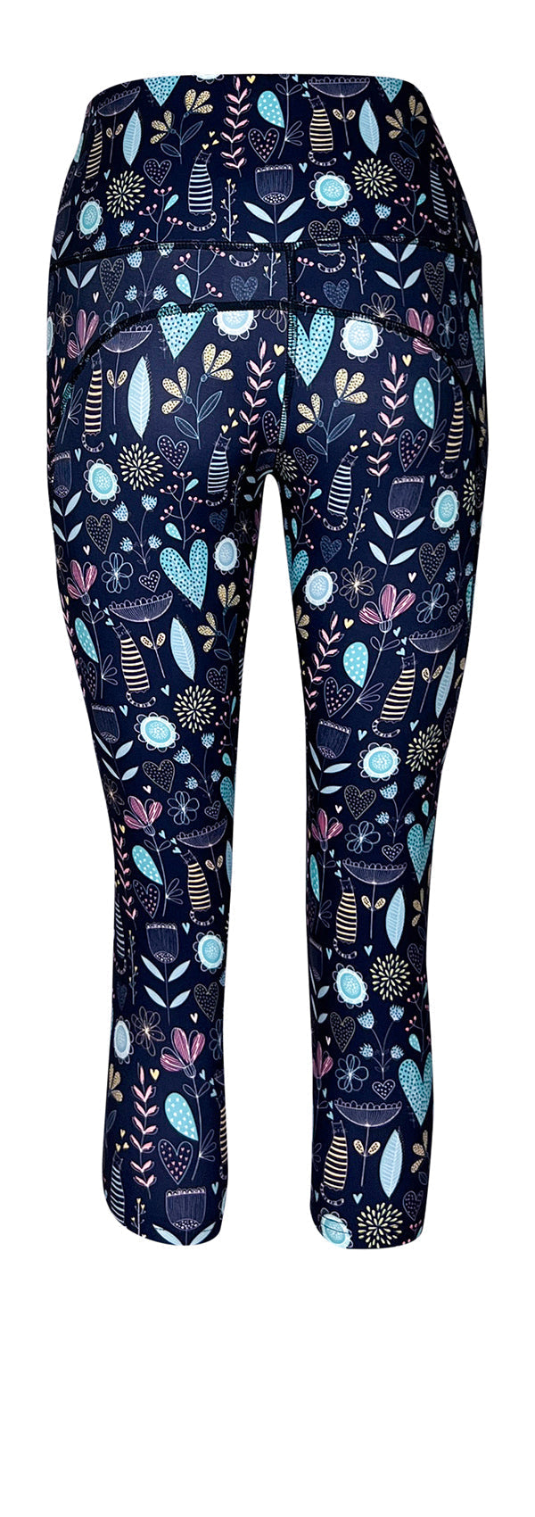 Navy leggings with pockets featuring whimsical pastel floral and heart patterns on a dark background